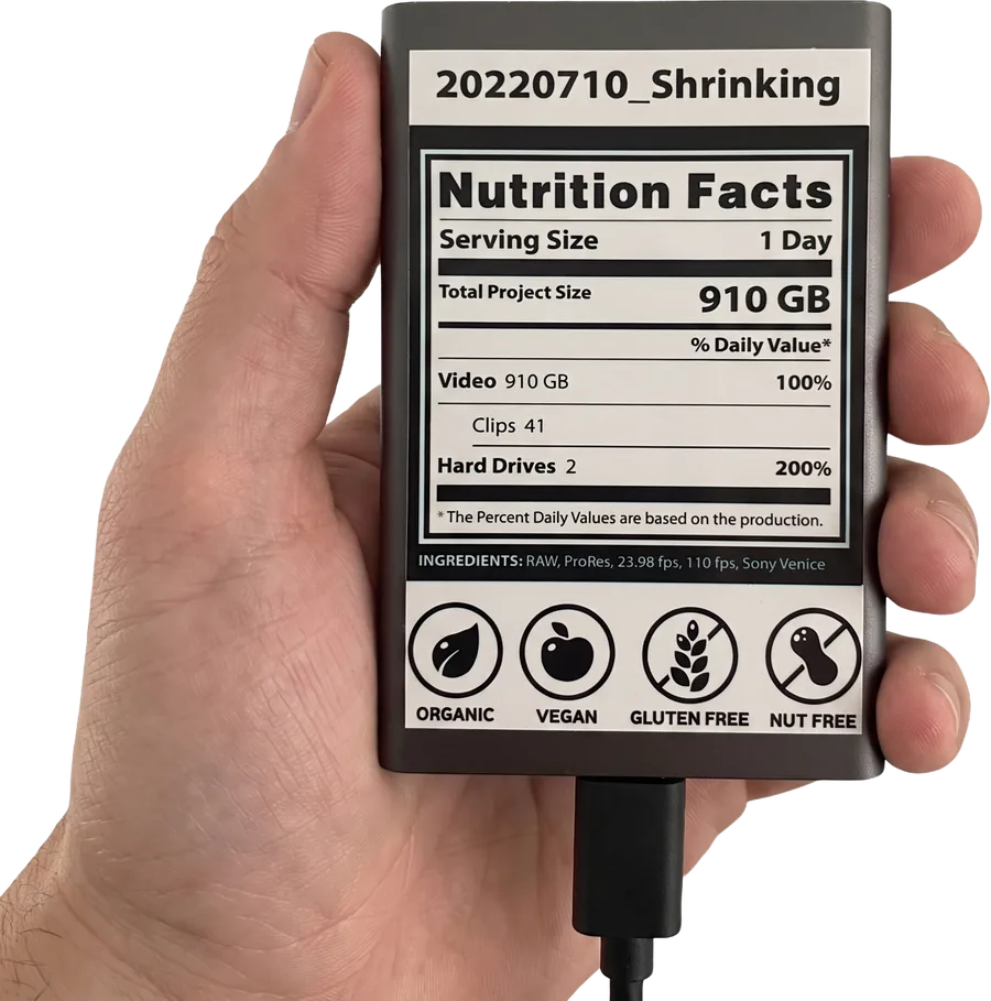 A hard drive labeled like a nutrition-facts panel — project '20220710_Shrinking', 910 GB, 41 clips, 2 drives, shot on Sony Venice.